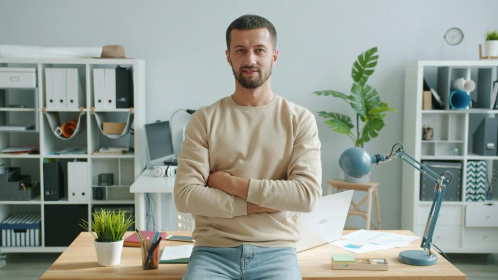 Young man in a stylish office environment, the image shows quiet and lucrative, best remote jobs for introverted personalities.