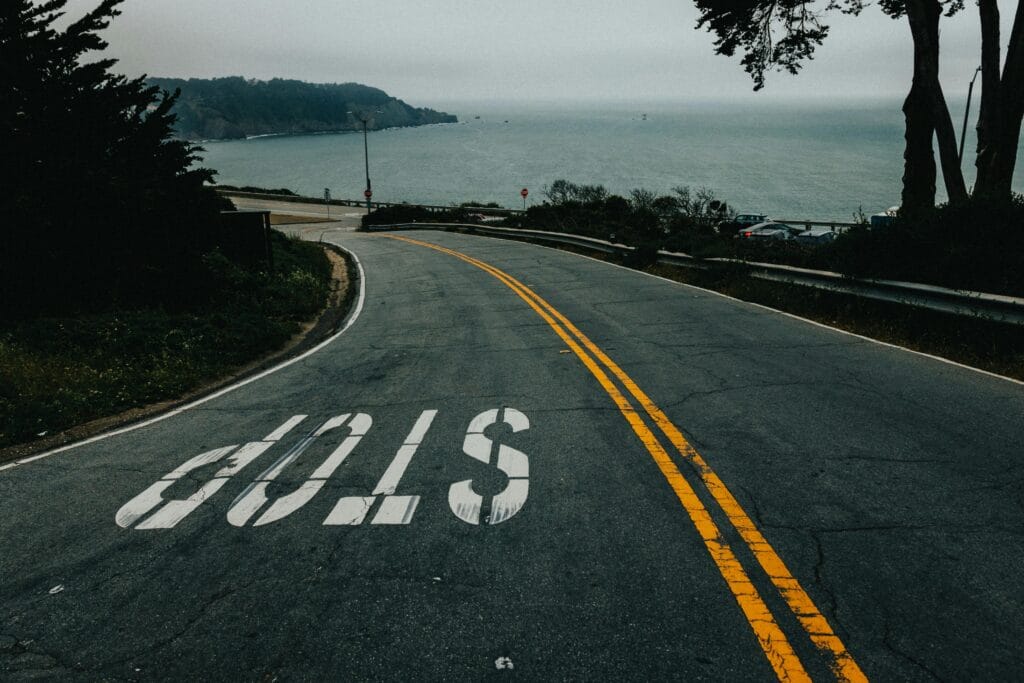 Curved road leading to the overthinking but with a clear stop sign.