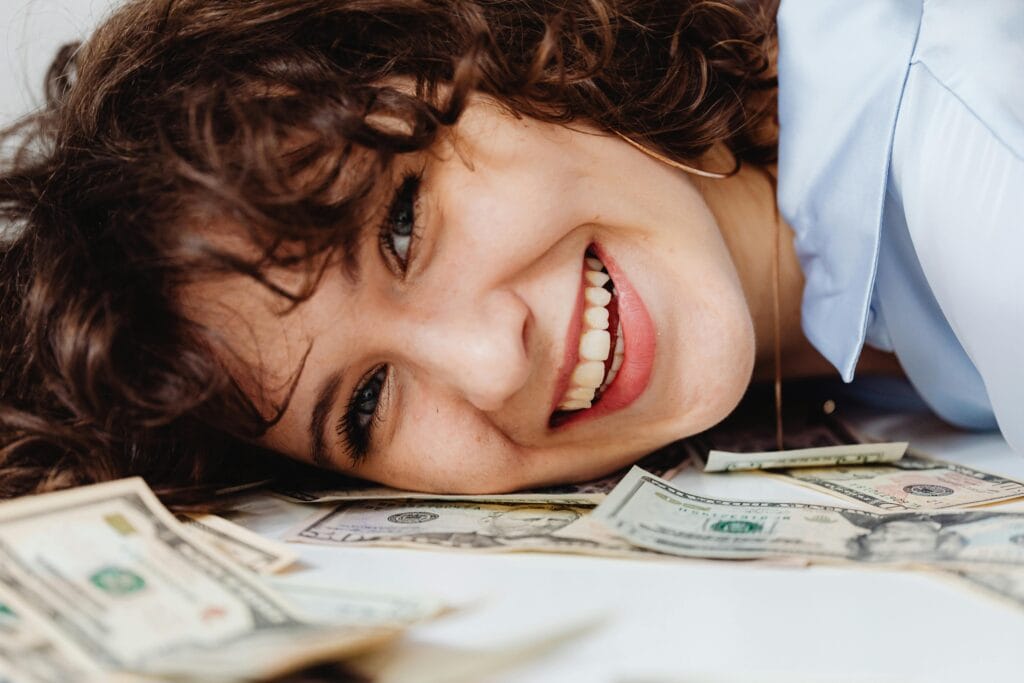 A joyful woman is representing the quiet and lucrative, best remote jobs for introverted personalities.