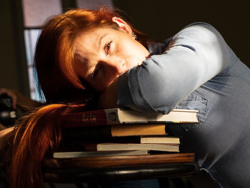 The image is illustrating best spiritual awakening books and reading spiritual books reduce anxiety and stress.